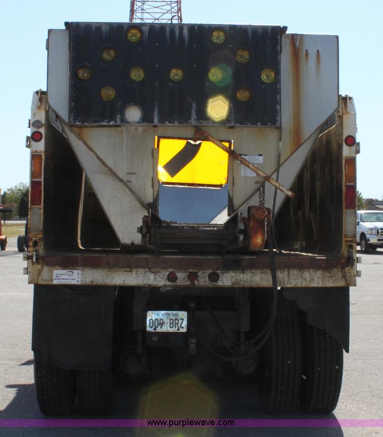 image for item A2891 1999 International 4900 tandem axle dump truck with plow and spreader