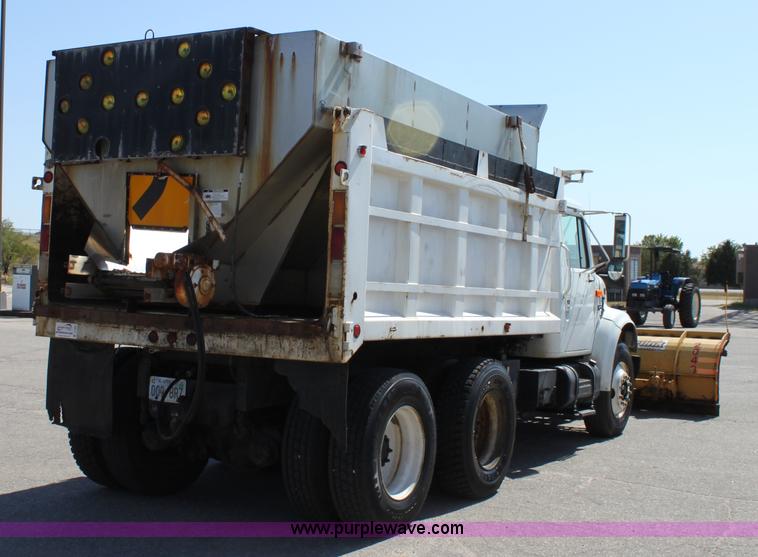 image for item A2891 1999 International 4900 tandem axle dump truck with plow and spreader