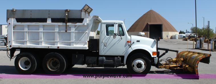 image for item A2891 1999 International 4900 tandem axle dump truck with plow and spreader