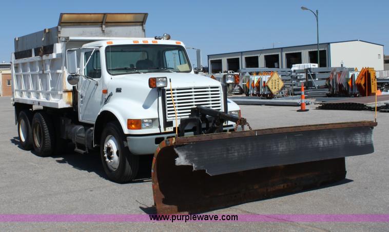 image for item A2891 1999 International 4900 tandem axle dump truck with plow and spreader