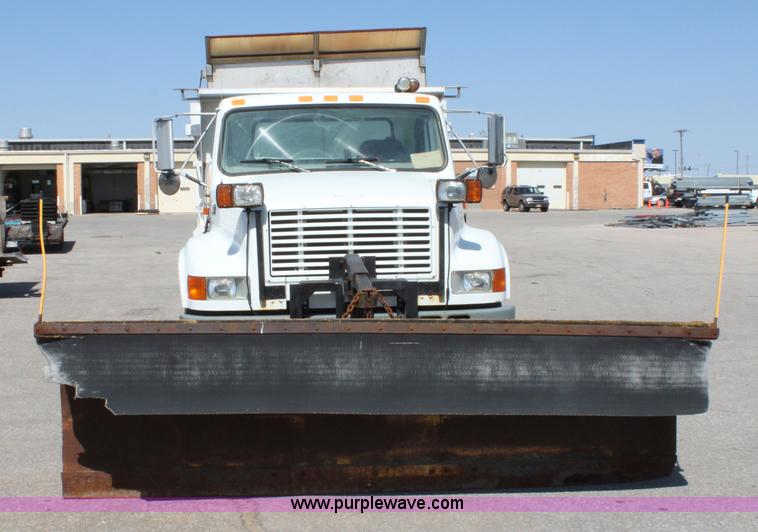 image for item A2891 1999 International 4900 tandem axle dump truck with plow and spreader