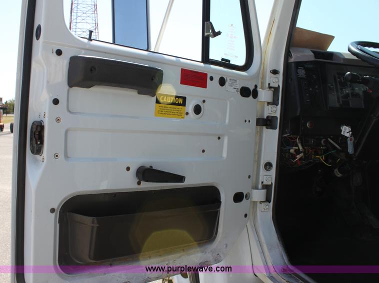 image for item A2891 1999 International 4900 tandem axle dump truck with plow and spreader