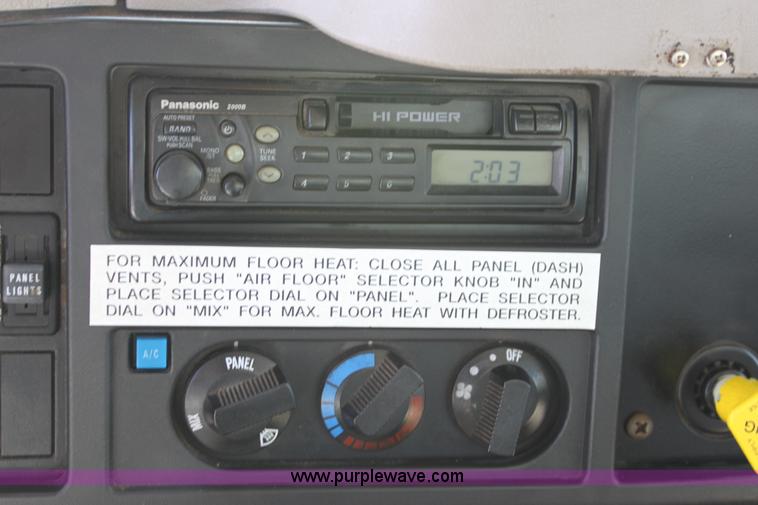 image for item A2891 1999 International 4900 tandem axle dump truck with plow and spreader