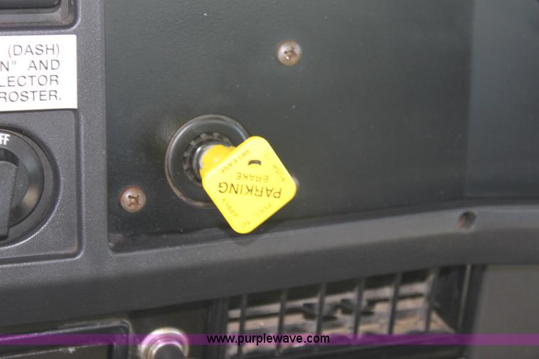 image for item A2891 1999 International 4900 tandem axle dump truck with plow and spreader