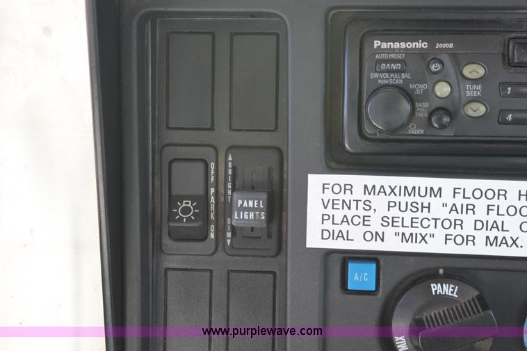 image for item A2891 1999 International 4900 tandem axle dump truck with plow and spreader