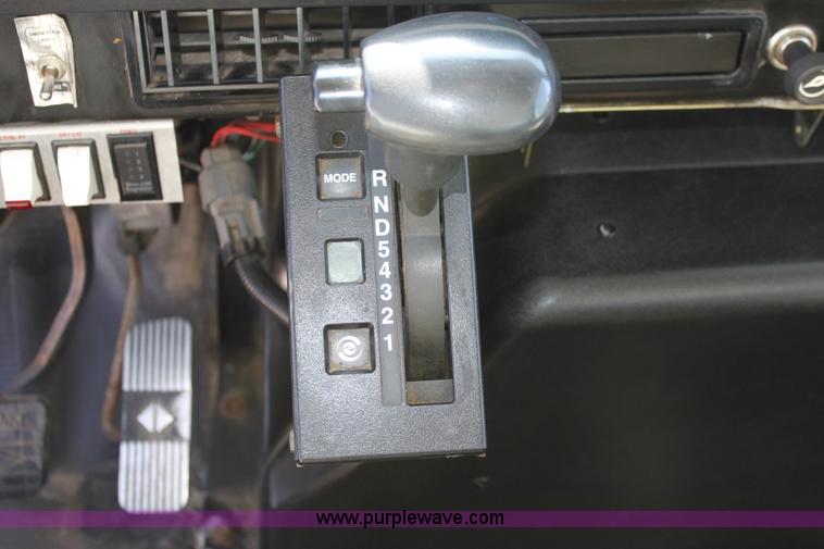 image for item A2891 1999 International 4900 tandem axle dump truck with plow and spreader