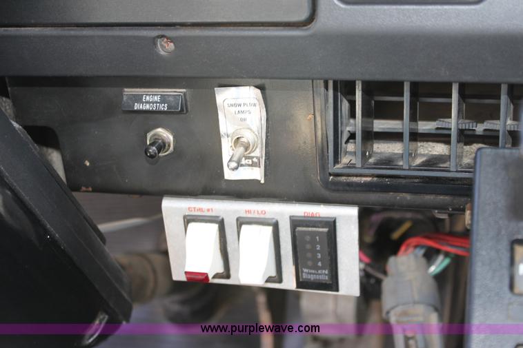 image for item A2891 1999 International 4900 tandem axle dump truck with plow and spreader