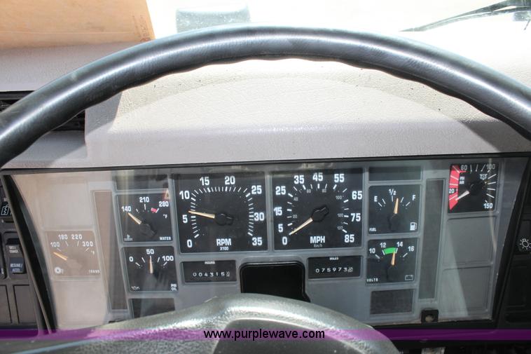 image for item A2891 1999 International 4900 tandem axle dump truck with plow and spreader