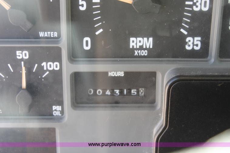 image for item A2891 1999 International 4900 tandem axle dump truck with plow and spreader