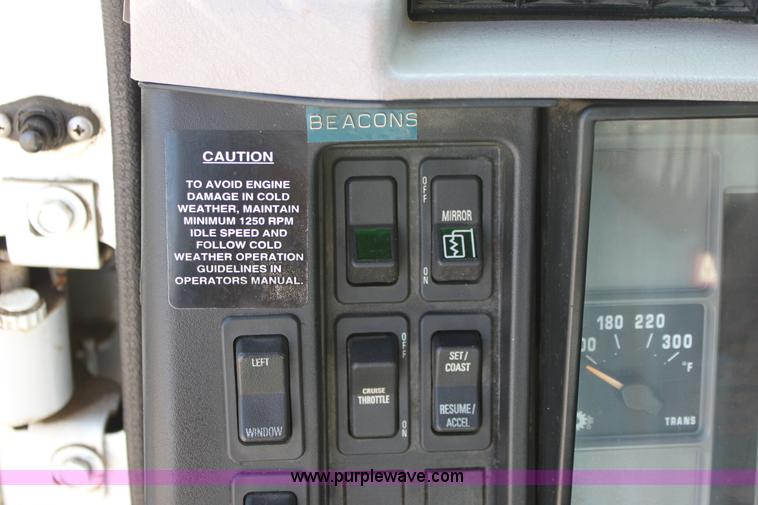 image for item A2891 1999 International 4900 tandem axle dump truck with plow and spreader