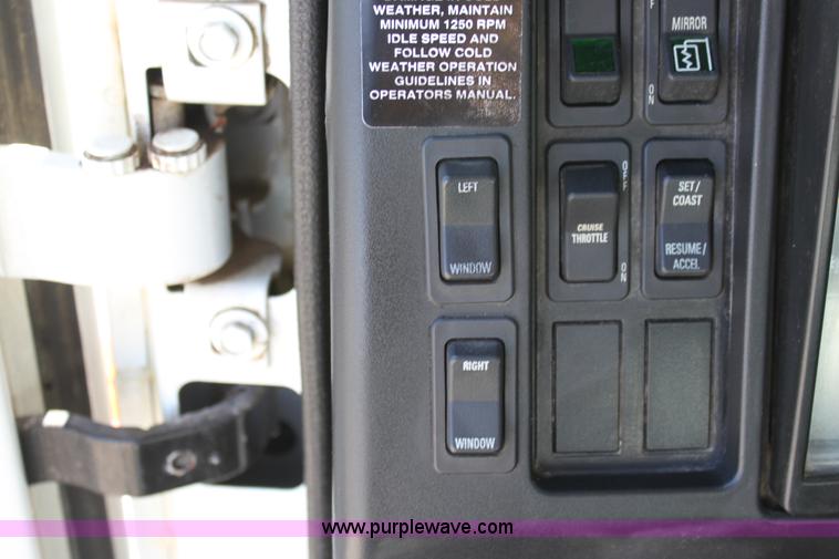 image for item A2891 1999 International 4900 tandem axle dump truck with plow and spreader