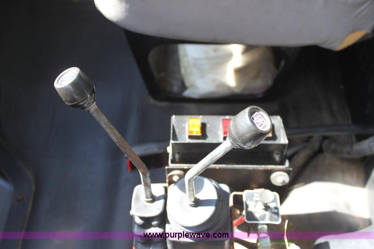 image for item A2891 1999 International 4900 tandem axle dump truck with plow and spreader