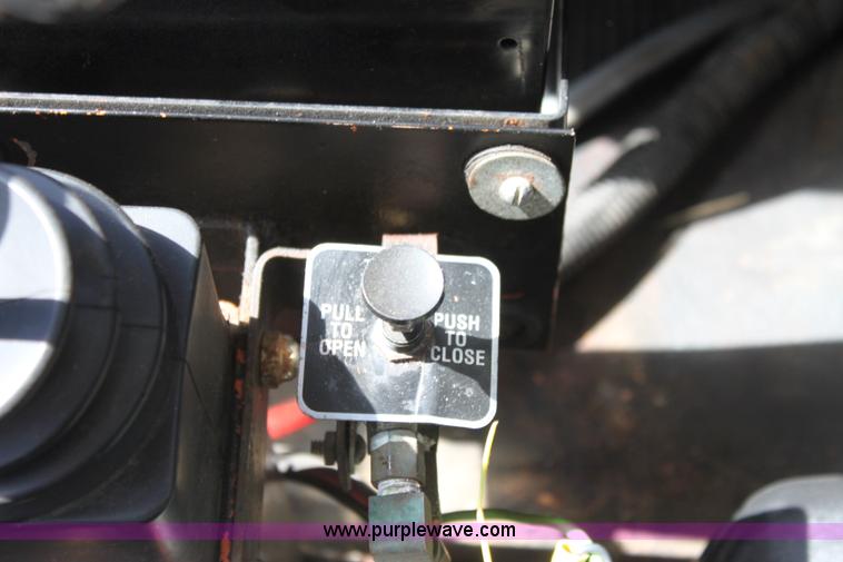 image for item A2891 1999 International 4900 tandem axle dump truck with plow and spreader