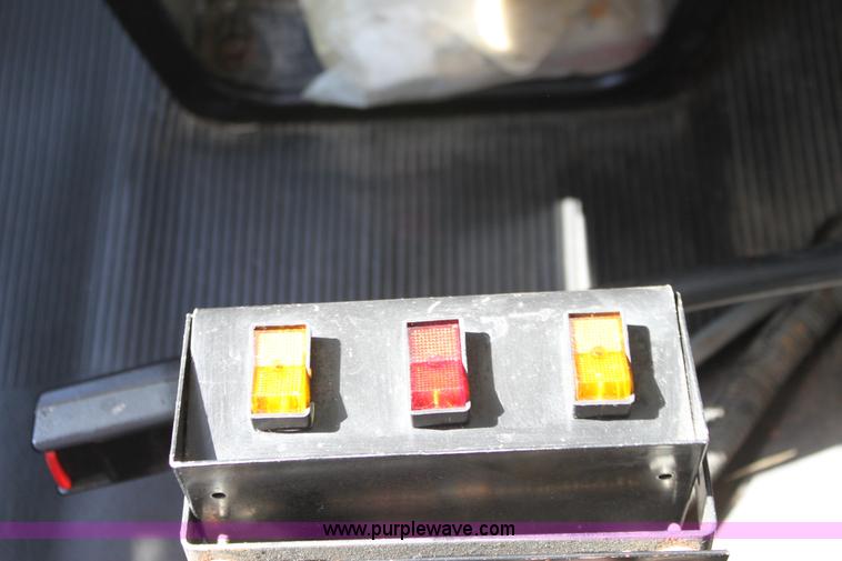 image for item A2891 1999 International 4900 tandem axle dump truck with plow and spreader