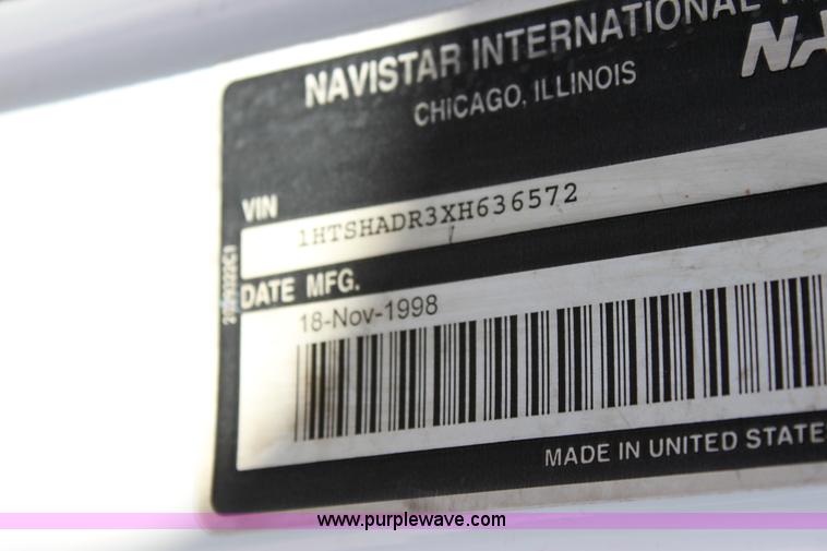 image for item A2891 1999 International 4900 tandem axle dump truck with plow and spreader