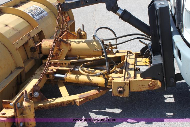 image for item A2891 1999 International 4900 tandem axle dump truck with plow and spreader