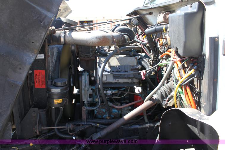 image for item A2891 1999 International 4900 tandem axle dump truck with plow and spreader