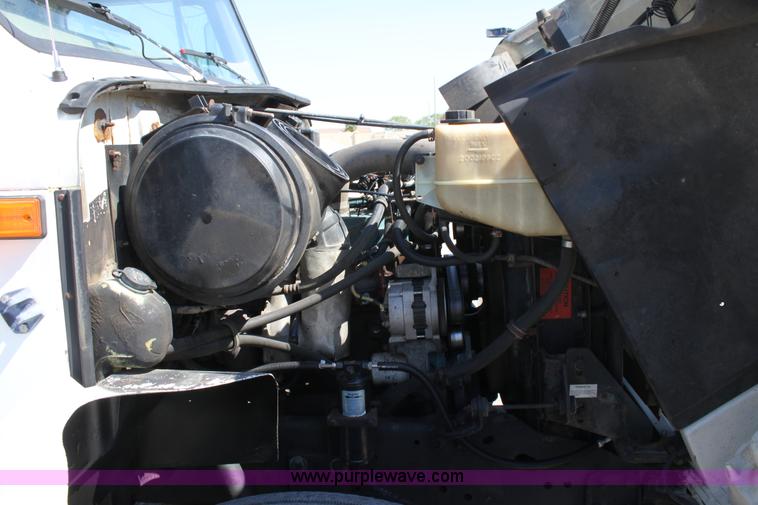 image for item A2891 1999 International 4900 tandem axle dump truck with plow and spreader