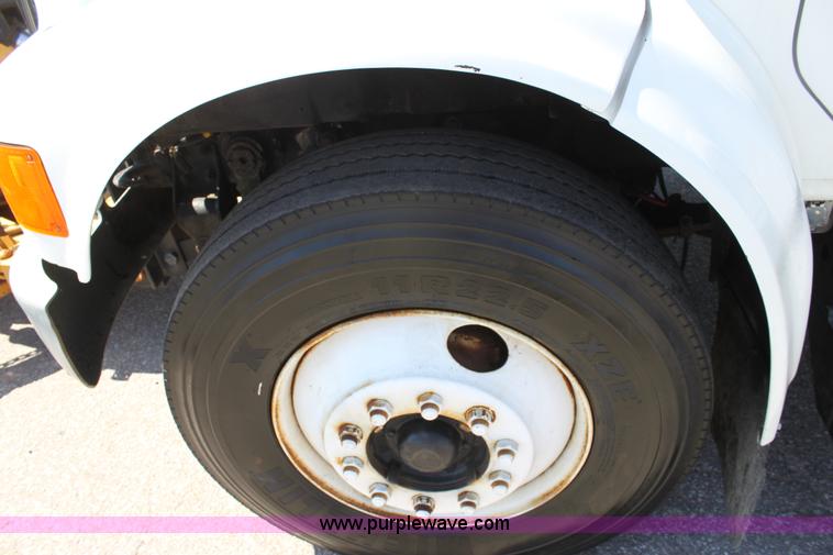 image for item A2891 1999 International 4900 tandem axle dump truck with plow and spreader