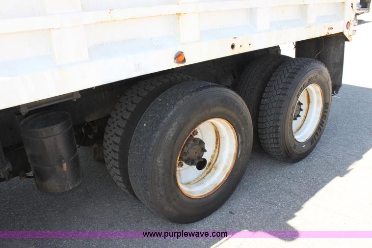 image for item A2891 1999 International 4900 tandem axle dump truck with plow and spreader