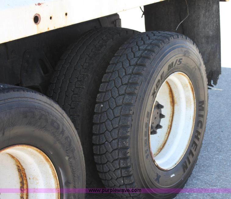 image for item A2891 1999 International 4900 tandem axle dump truck with plow and spreader