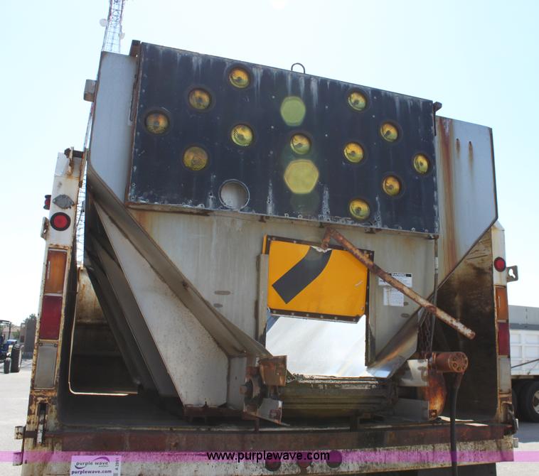 image for item A2891 1999 International 4900 tandem axle dump truck with plow and spreader