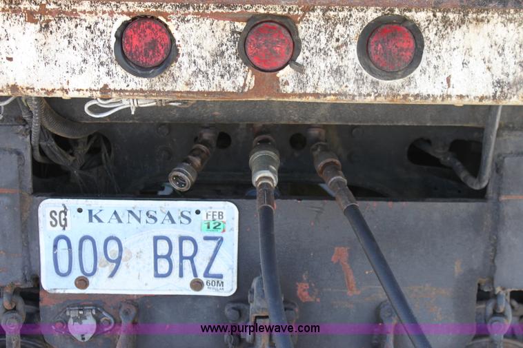 image for item A2891 1999 International 4900 tandem axle dump truck with plow and spreader