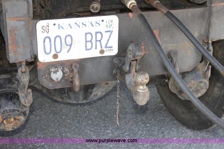 image for item A2891 1999 International 4900 tandem axle dump truck with plow and spreader