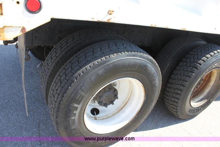 image for item A2891 1999 International 4900 tandem axle dump truck with plow and spreader