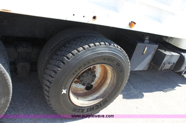 image for item A2891 1999 International 4900 tandem axle dump truck with plow and spreader