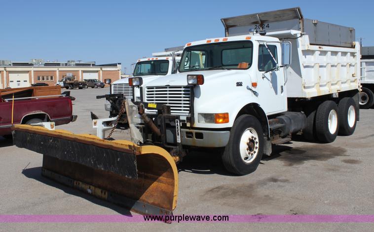image for item A2893 1999 International 4900 tandem axle dump truck with plow and spreader
