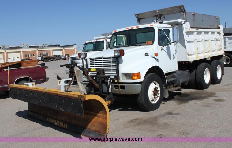 image for item A2893 1999 International 4900 tandem axle dump truck with plow and spreader