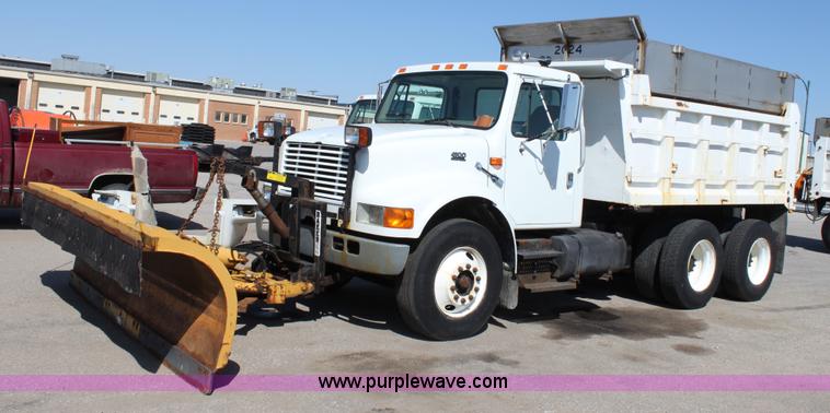 image for item A2893 1999 International 4900 tandem axle dump truck with plow and spreader