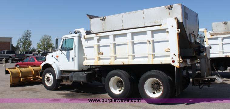 image for item A2893 1999 International 4900 tandem axle dump truck with plow and spreader