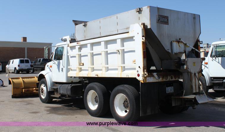 image for item A2893 1999 International 4900 tandem axle dump truck with plow and spreader