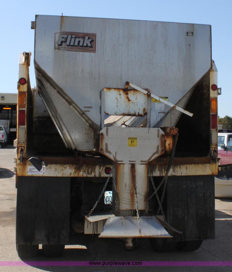 image for item A2893 1999 International 4900 tandem axle dump truck with plow and spreader