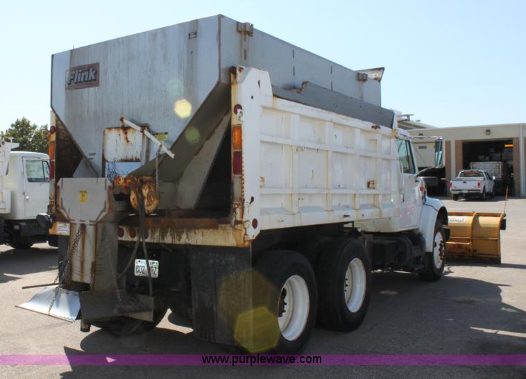 image for item A2893 1999 International 4900 tandem axle dump truck with plow and spreader