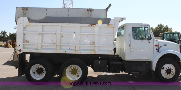image for item A2893 1999 International 4900 tandem axle dump truck with plow and spreader