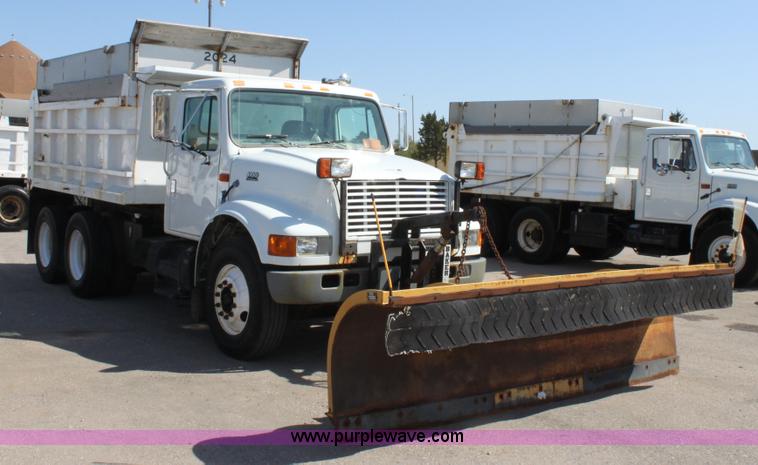 image for item A2893 1999 International 4900 tandem axle dump truck with plow and spreader