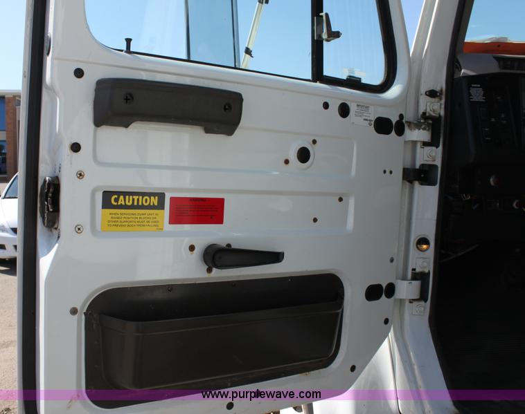 image for item A2893 1999 International 4900 tandem axle dump truck with plow and spreader