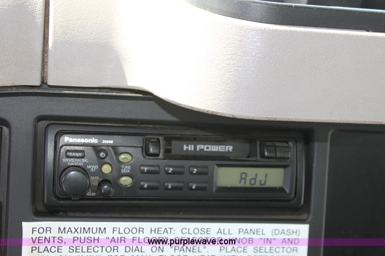 image for item A2893 1999 International 4900 tandem axle dump truck with plow and spreader