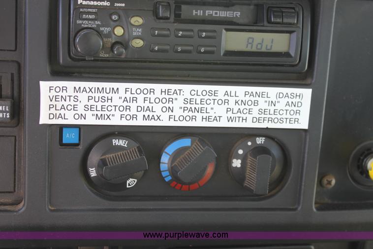 image for item A2893 1999 International 4900 tandem axle dump truck with plow and spreader