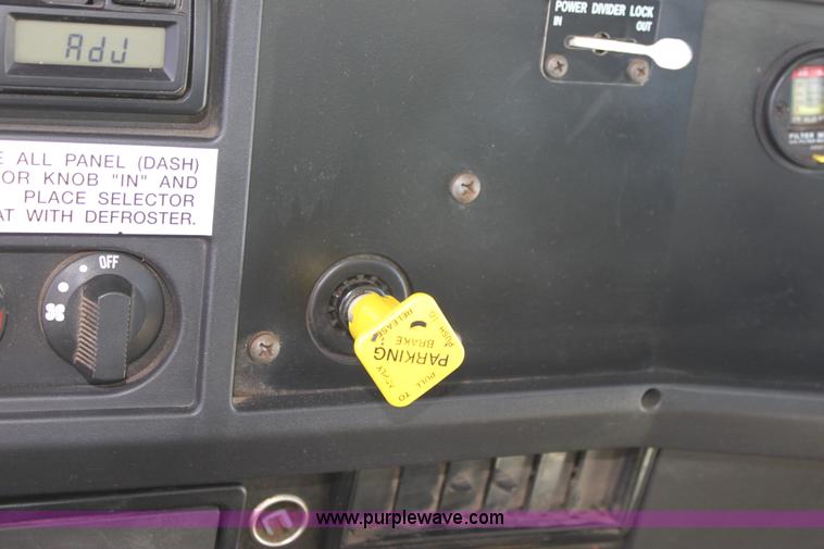 image for item A2893 1999 International 4900 tandem axle dump truck with plow and spreader