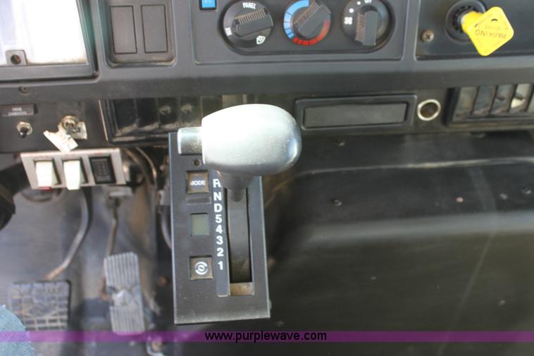 image for item A2893 1999 International 4900 tandem axle dump truck with plow and spreader