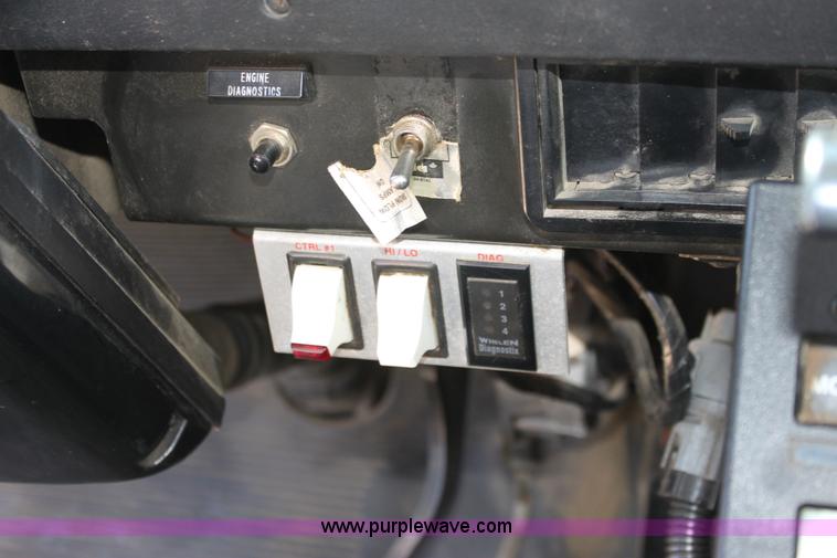 image for item A2893 1999 International 4900 tandem axle dump truck with plow and spreader