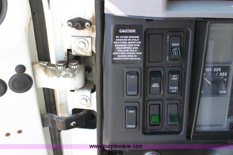 image for item A2893 1999 International 4900 tandem axle dump truck with plow and spreader