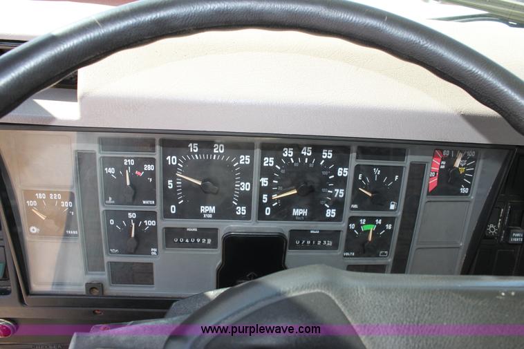 image for item A2893 1999 International 4900 tandem axle dump truck with plow and spreader