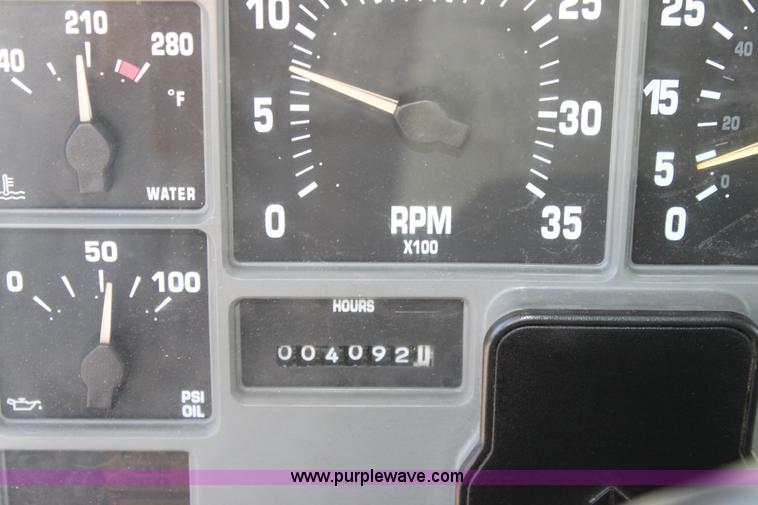 image for item A2893 1999 International 4900 tandem axle dump truck with plow and spreader