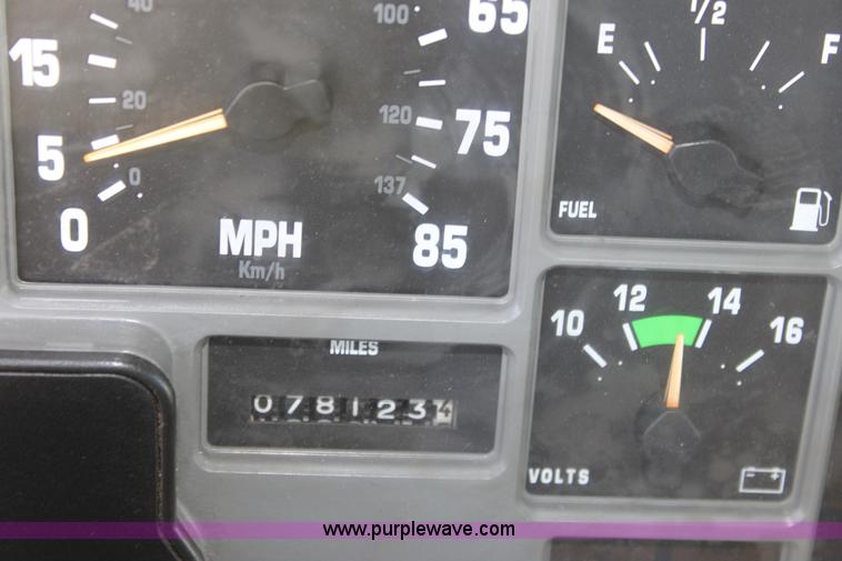 image for item A2893 1999 International 4900 tandem axle dump truck with plow and spreader