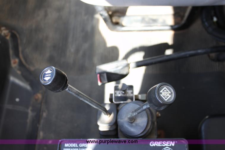 image for item A2893 1999 International 4900 tandem axle dump truck with plow and spreader